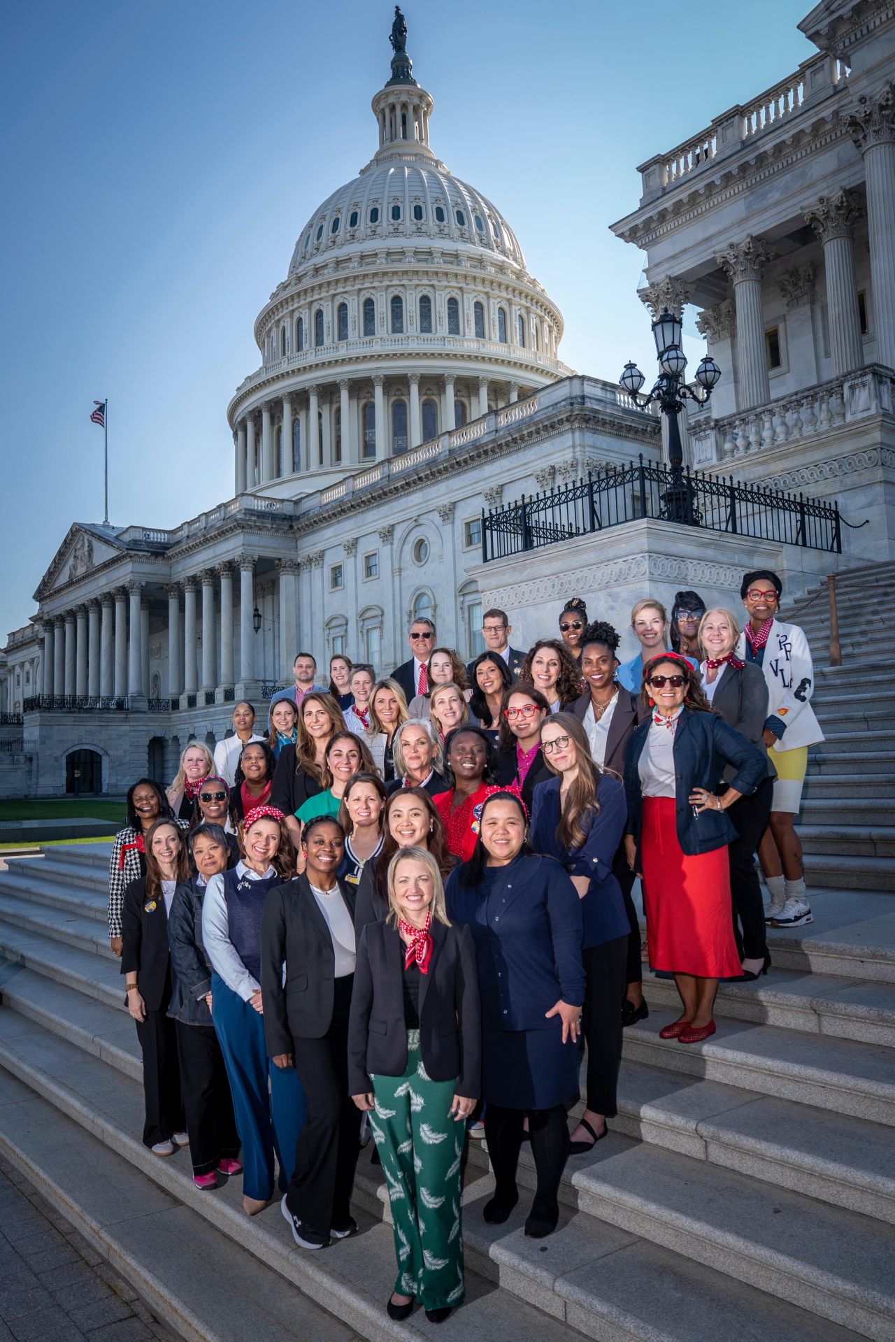 Over 50 Military Spouse's joined together on the steps of the Capitol Hill building to advocate for spouse benefits